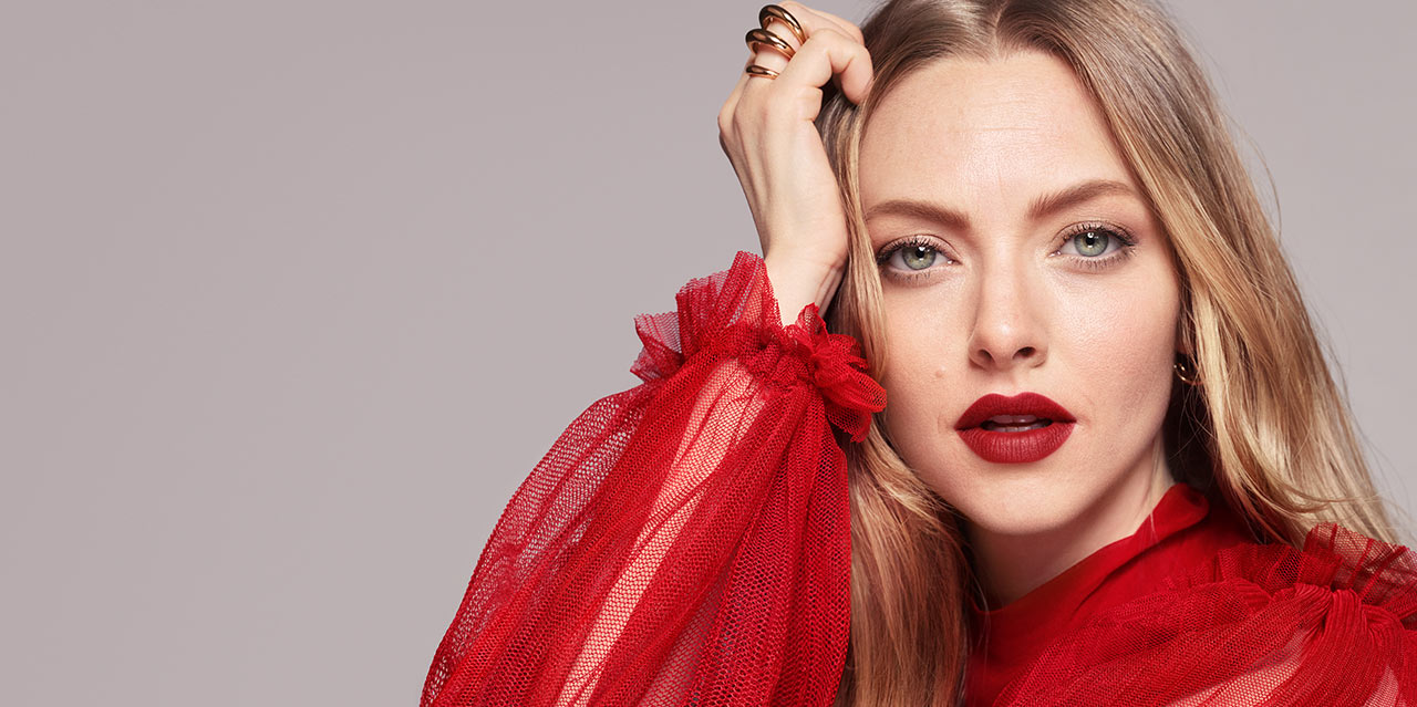 Amanda Seyfried wearing a bold matte deep red lipstick shade.